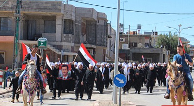 Golan occupé: des centaines de manifestants commémorent l’indépendance de la Syrie, sous le portait d’Assad