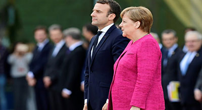 Zone euro: Merkel et Macron se disent ouverts à l’idée d’un changement de traité européen


