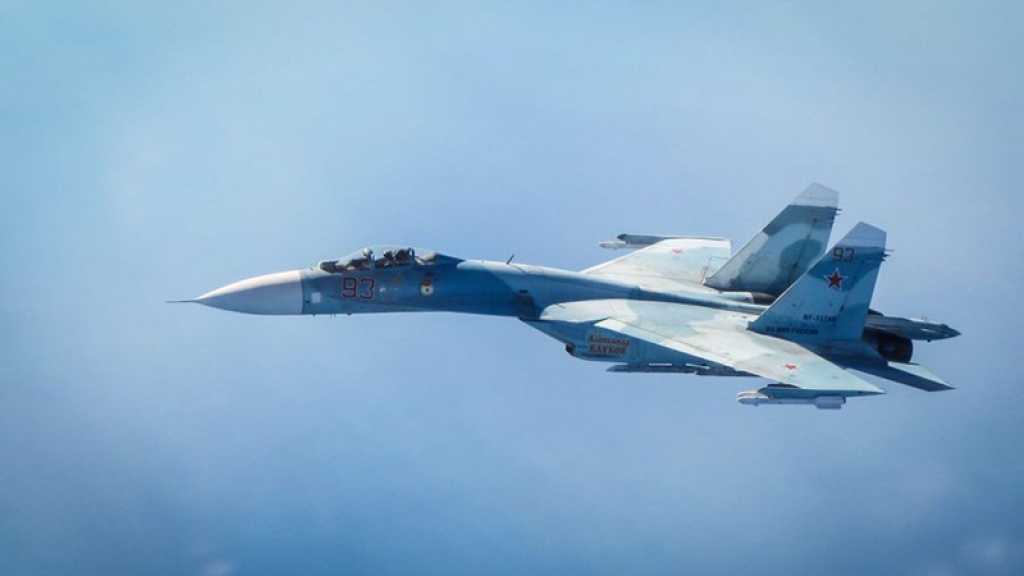 Un Su-27 russe escorte un avion espion US au-dessus de la mer Noire